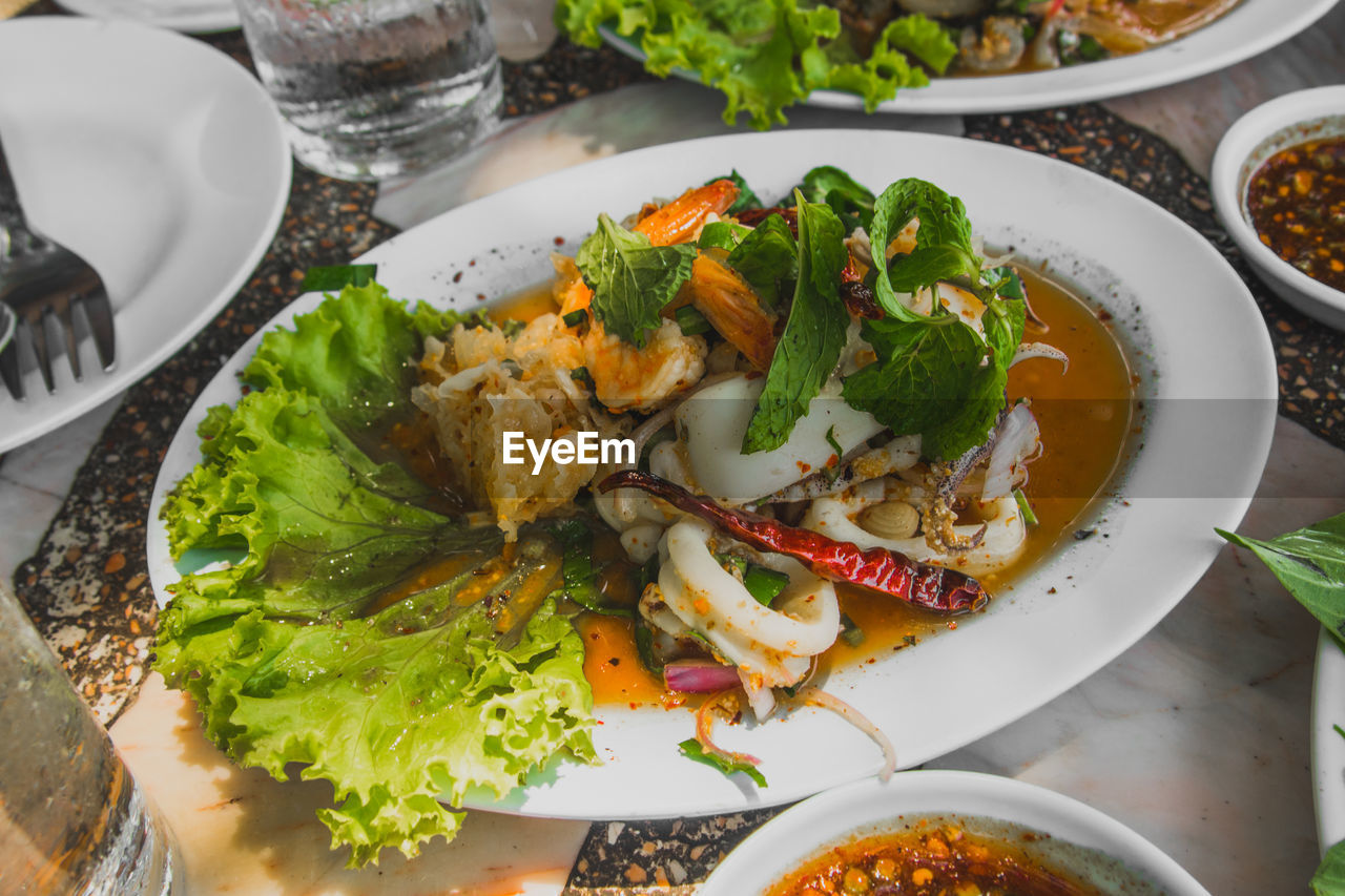 High angle view of fresh meal served on table at restaurant