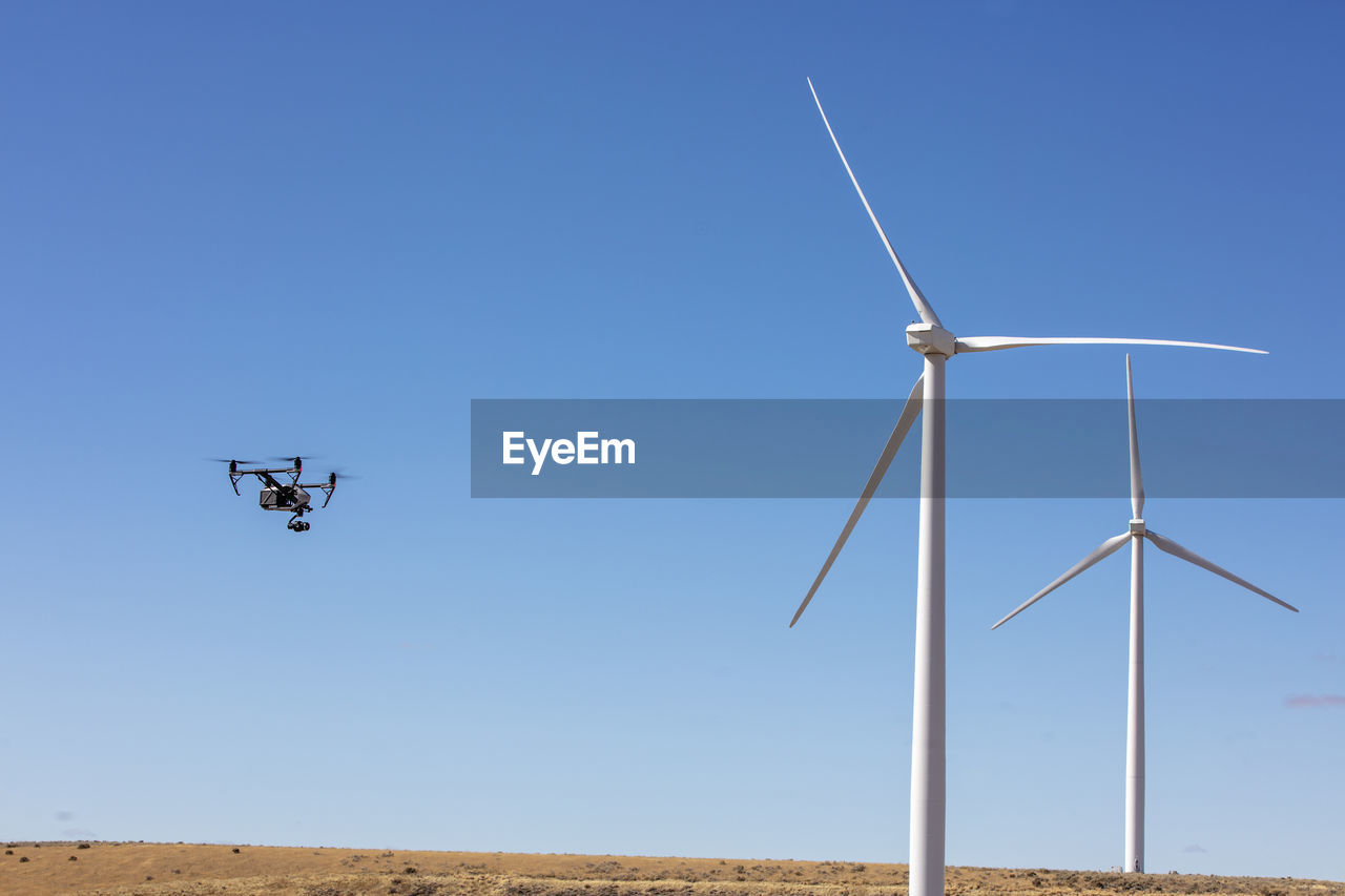 Wind turbines on field with camera drone