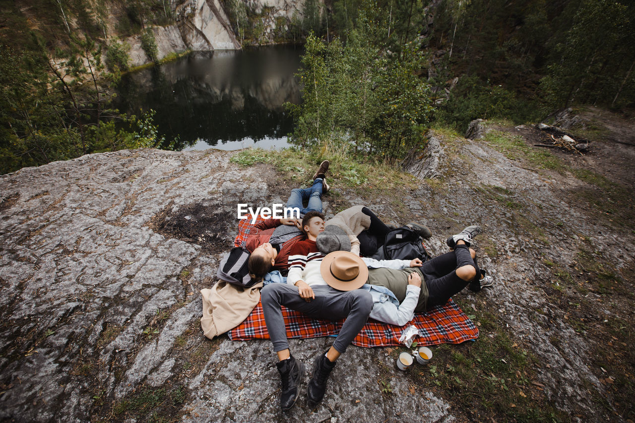 Group of people lying together on blanket