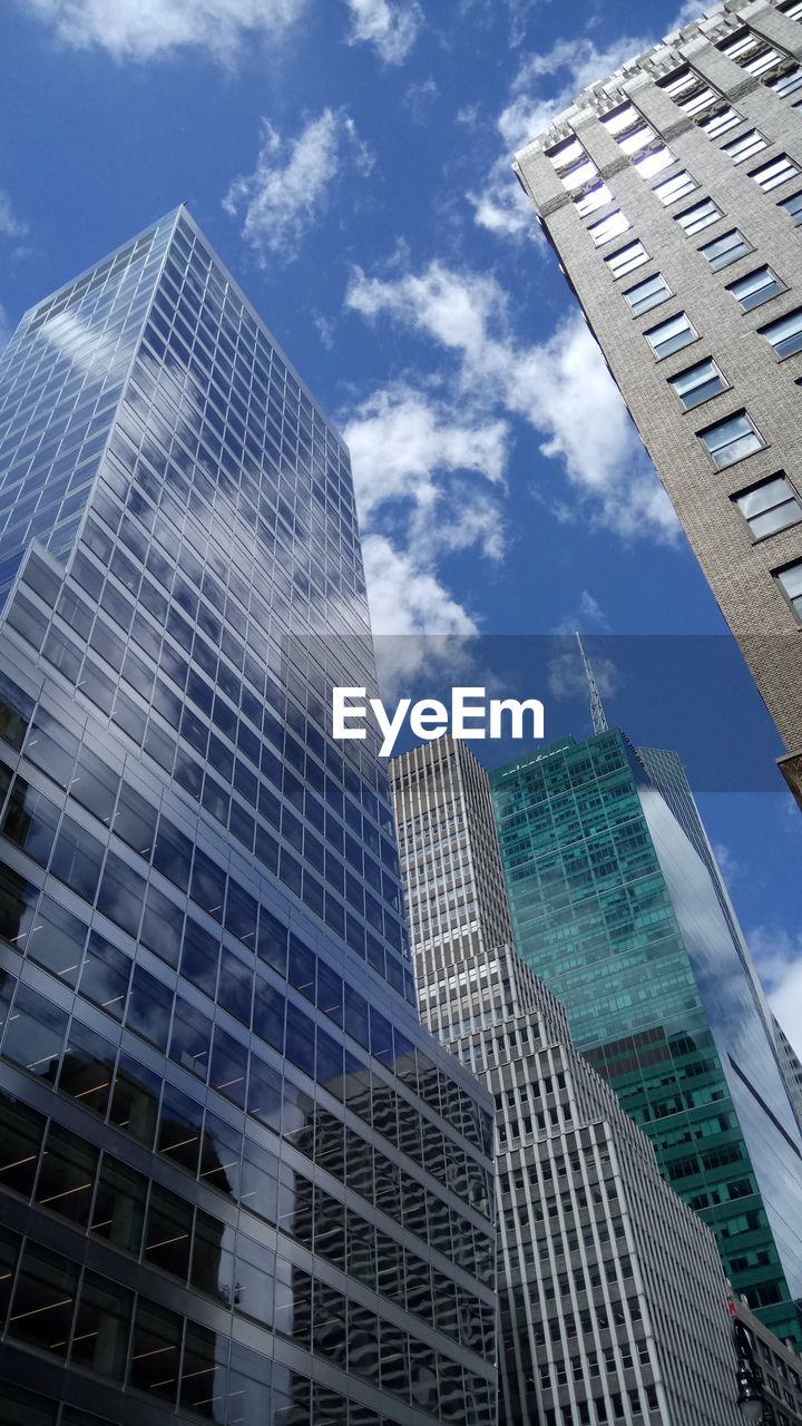 LOW ANGLE VIEW OF OFFICE BUILDINGS AGAINST SKY