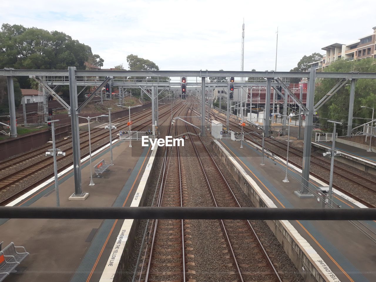 HIGH ANGLE VIEW OF RAILROAD TRACKS IN CITY
