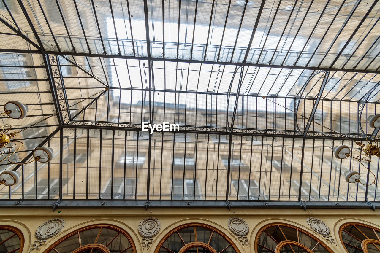 LOW ANGLE VIEW OF BUILDING SEEN THROUGH SKYLIGHT