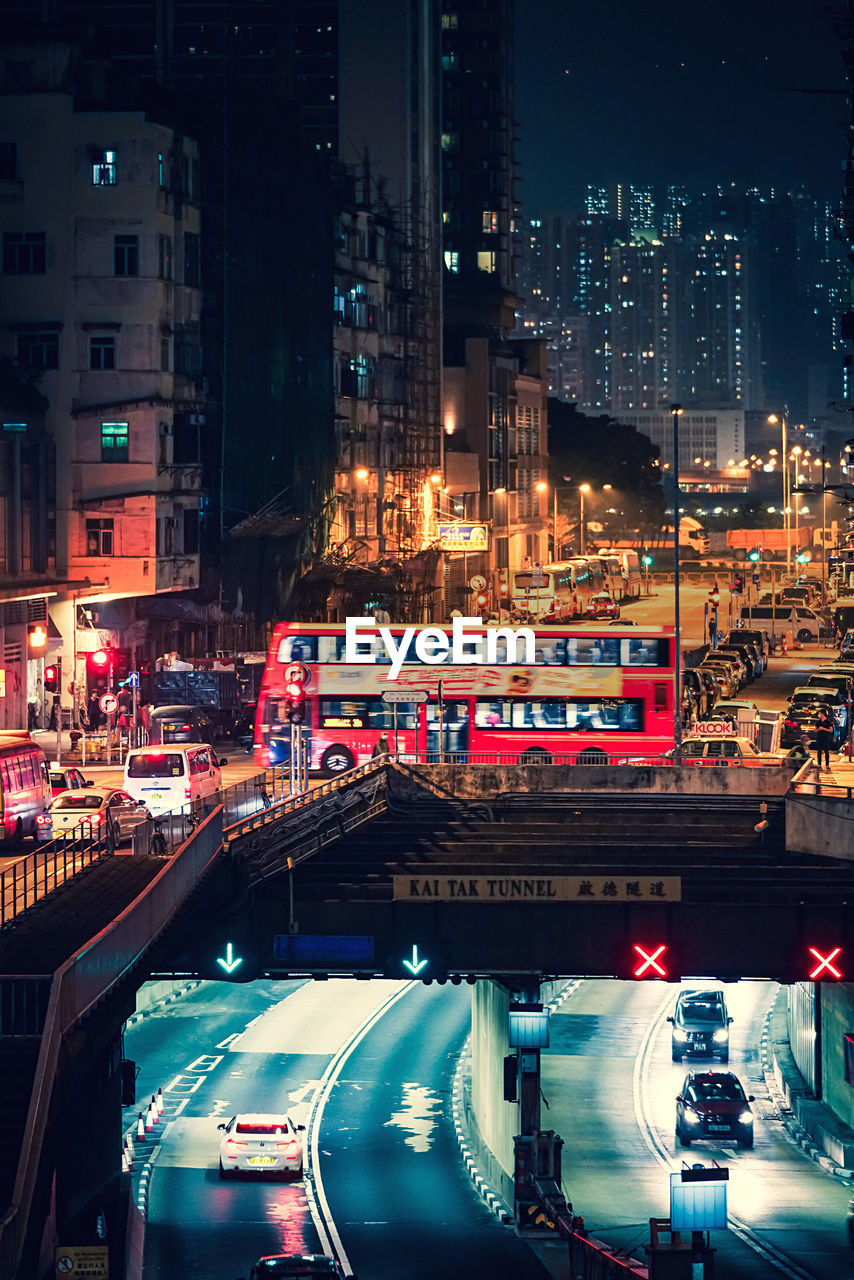 High angle view of illuminated city street and buildings at night