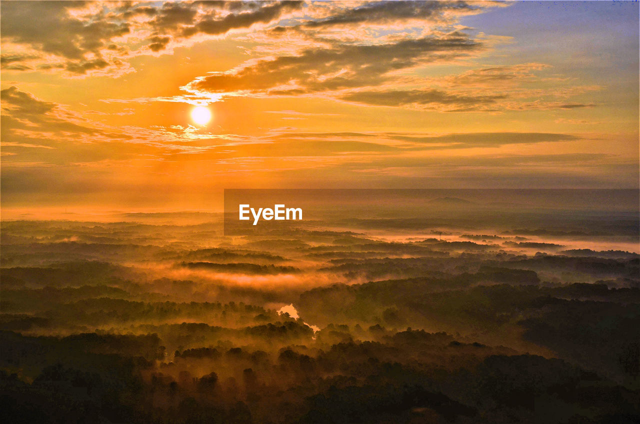 SCENIC VIEW OF SUNSET OVER MOUNTAINS