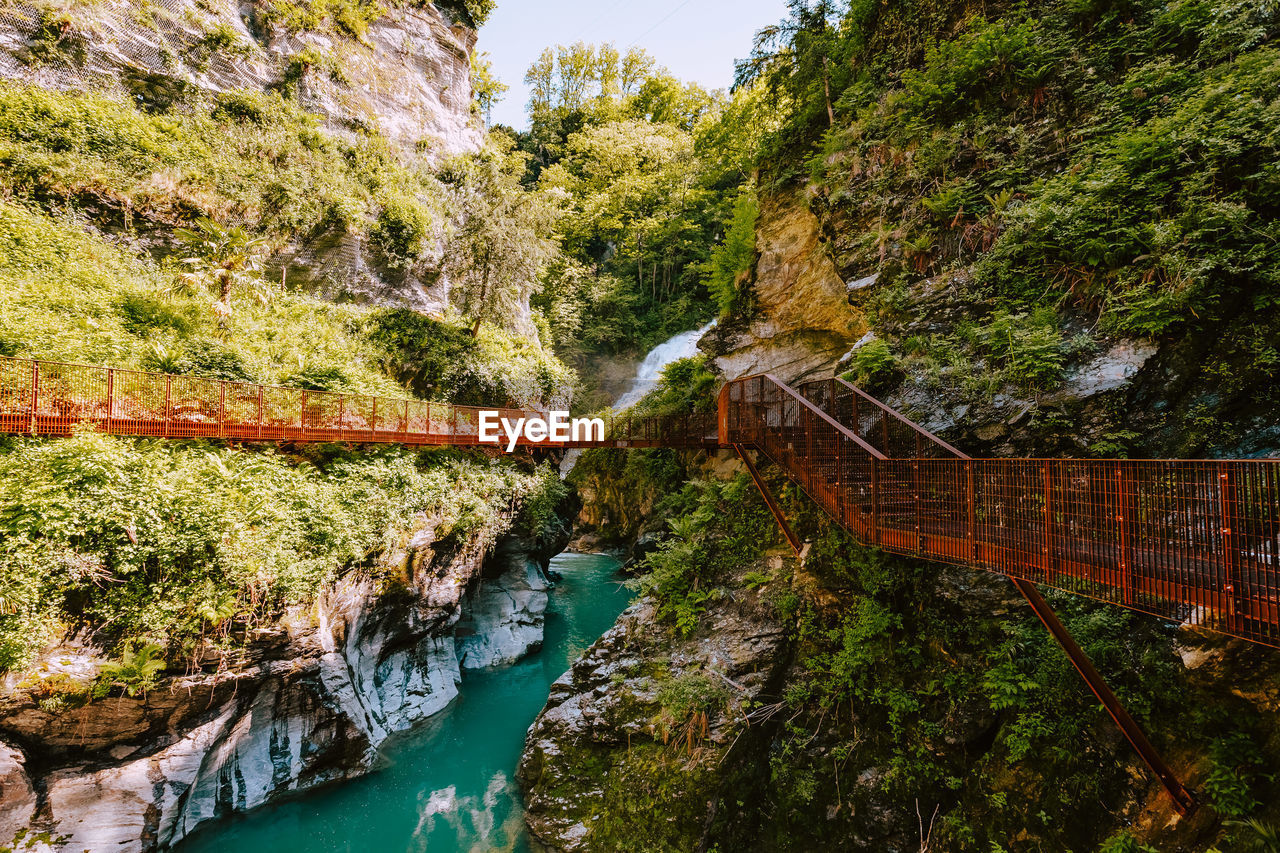 high angle view of bridge over river amidst trees