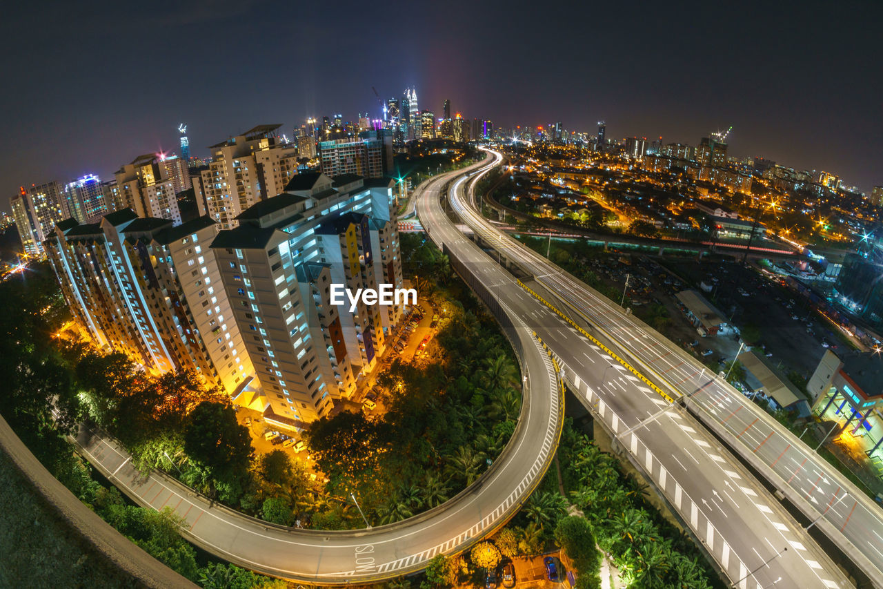 High angle view of illuminated cityscape at night