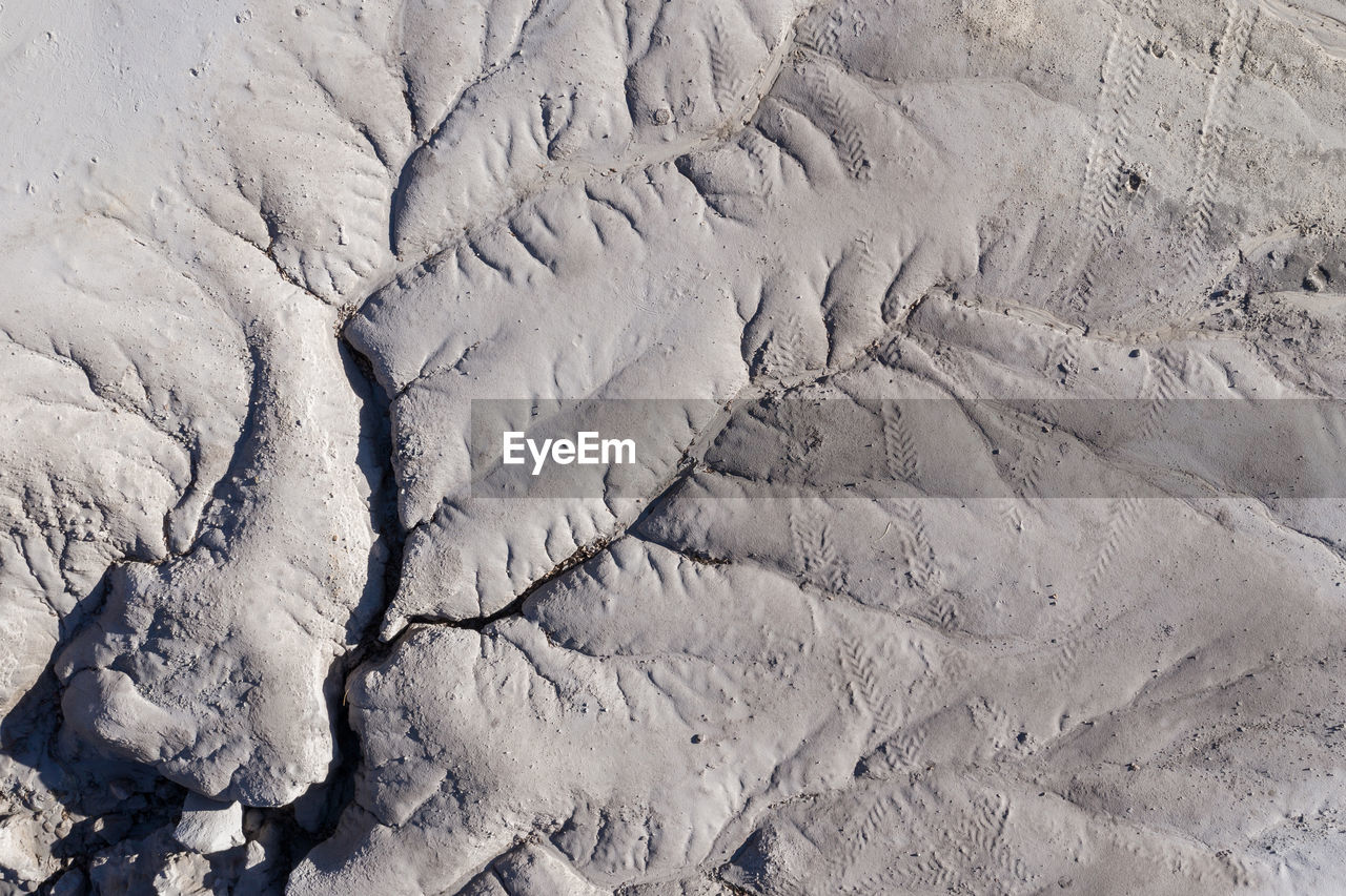 Aerial shot of abandoned opencast mine. abstract cracked mud pattern, erosion, bad land from a drone