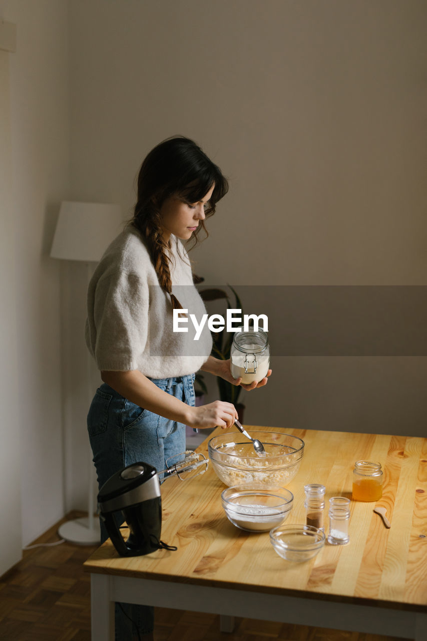 Young woman making christmas cookies