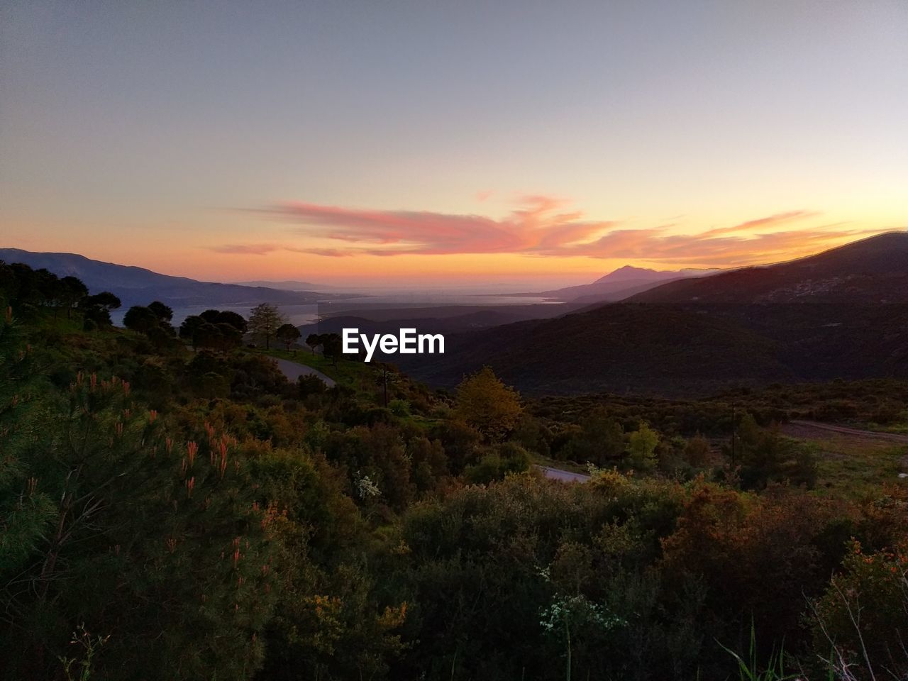 Scenic view of landscape against sky during sunset