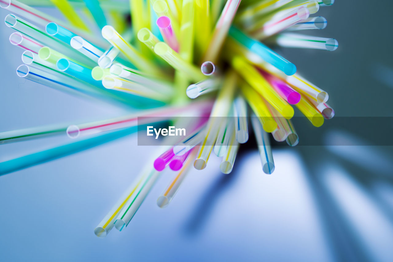 Close-up of colorful drinking straws on table