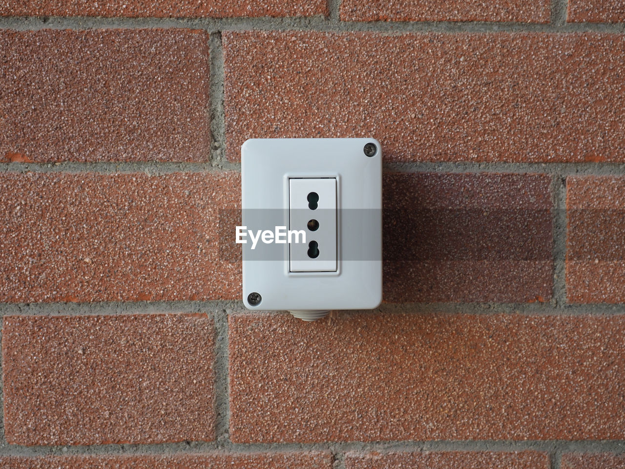 wall - building feature, wall, electricity, power plugs and sockets, no people, brick, floor, flooring, built structure, technology, architecture, tile, brick wall, close-up, textured, power supply, day, light switch