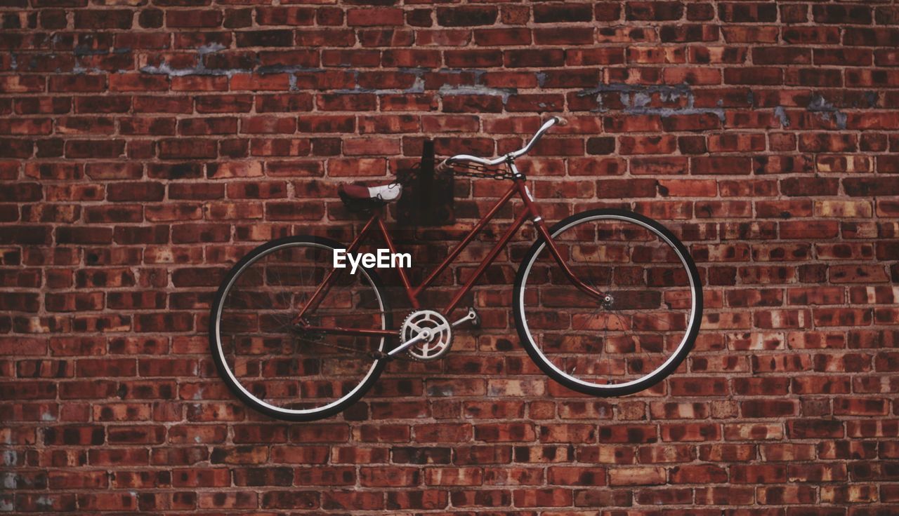 Bicycle against brick wall