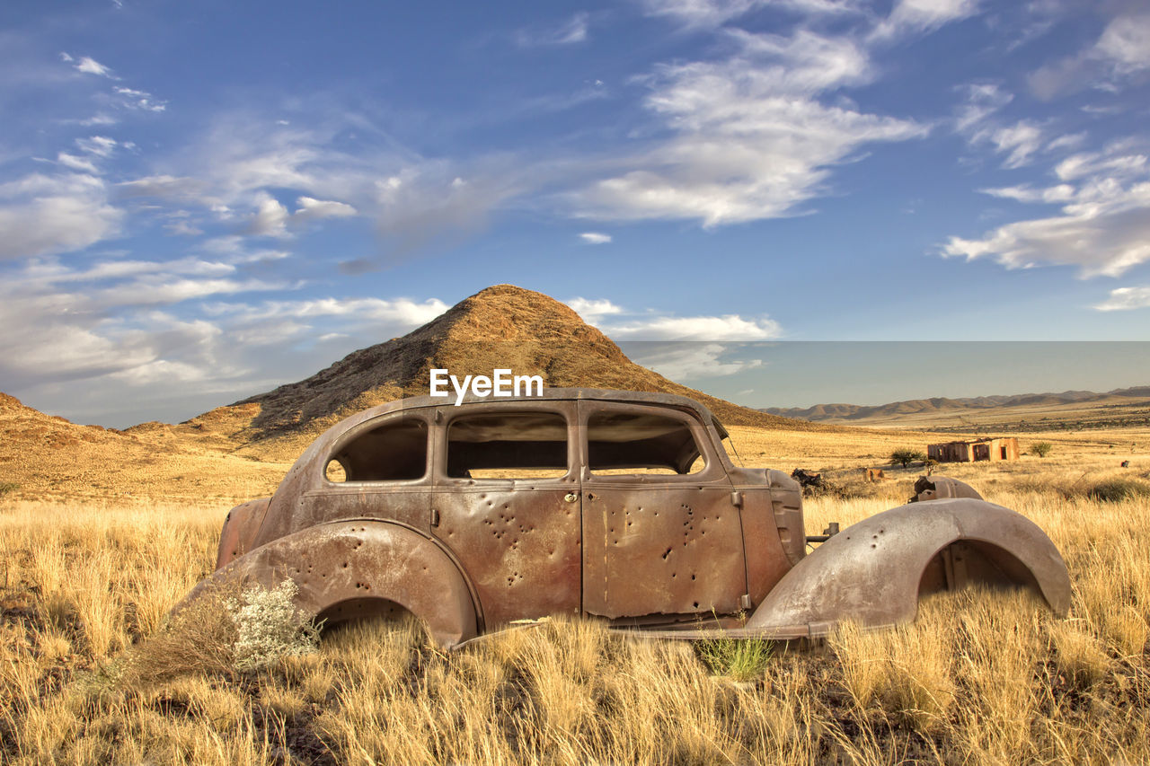 ABANDONED TRUCK ON FIELD