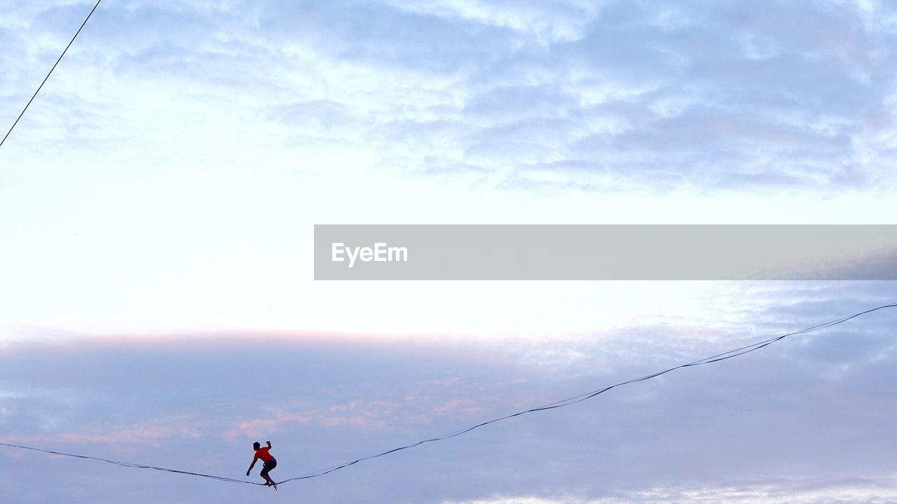 Low angle view of man against sky