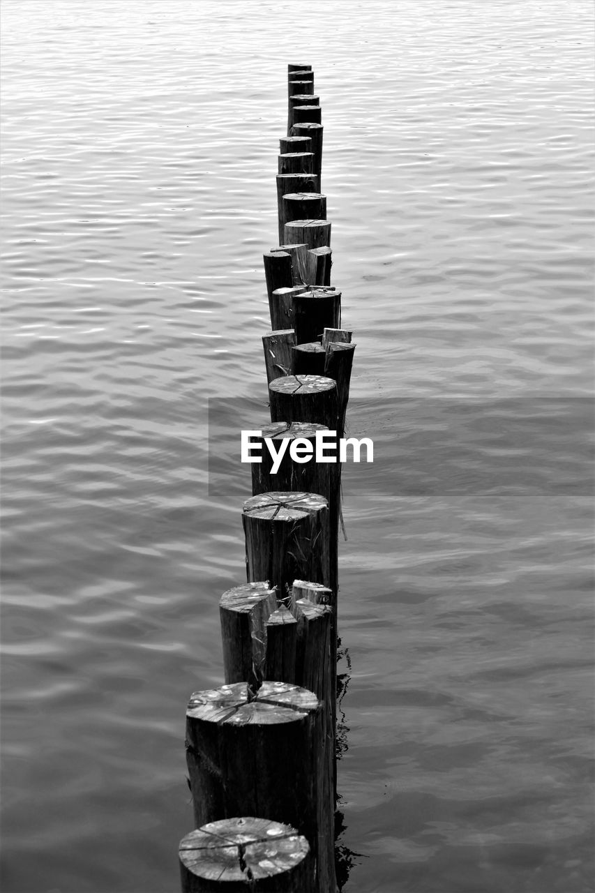 High angle view of wooden post in lake