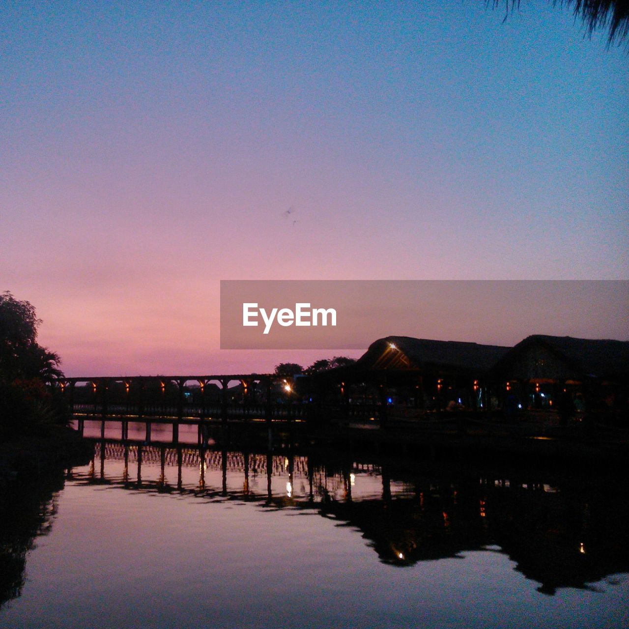 VIEW OF RIVER AT DUSK