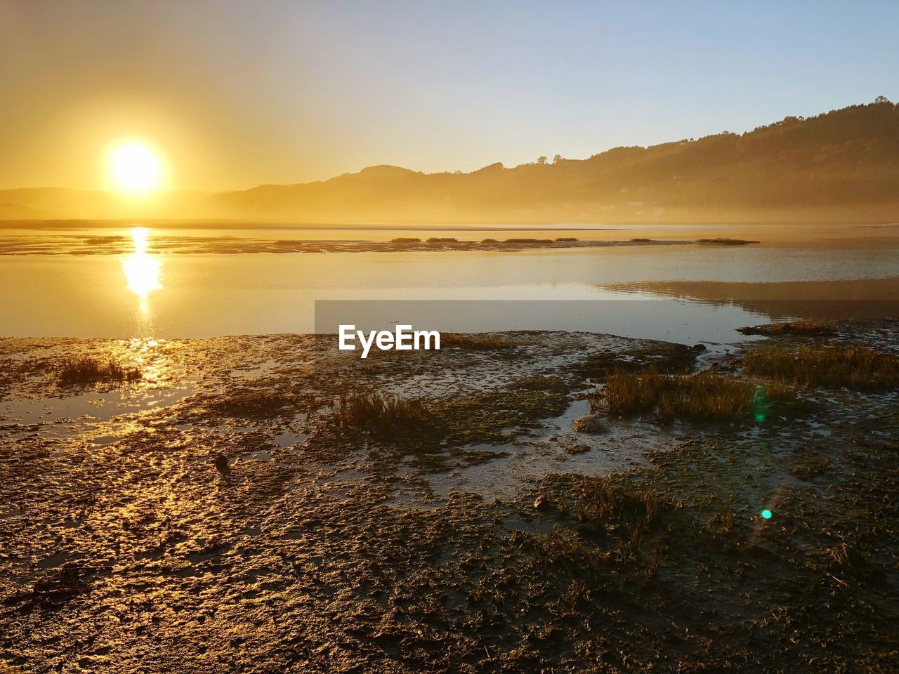 View of beach at sunset