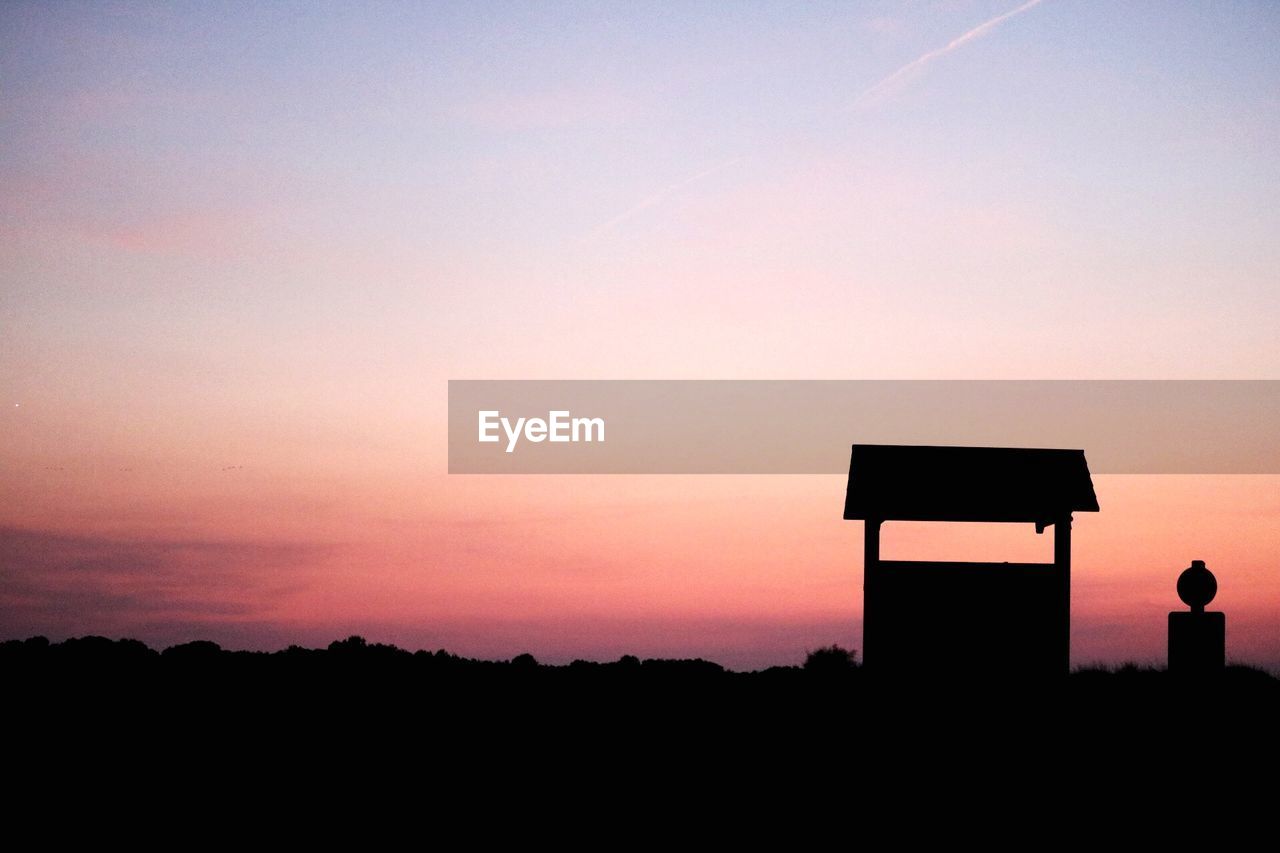 SILHOUETTE LANDSCAPE AGAINST SKY AT SUNSET