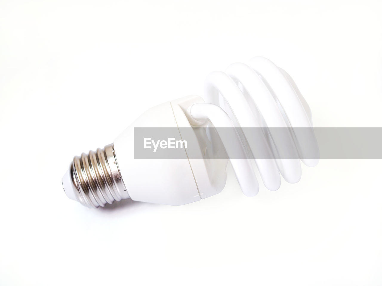 Close-up of light bulb against white background