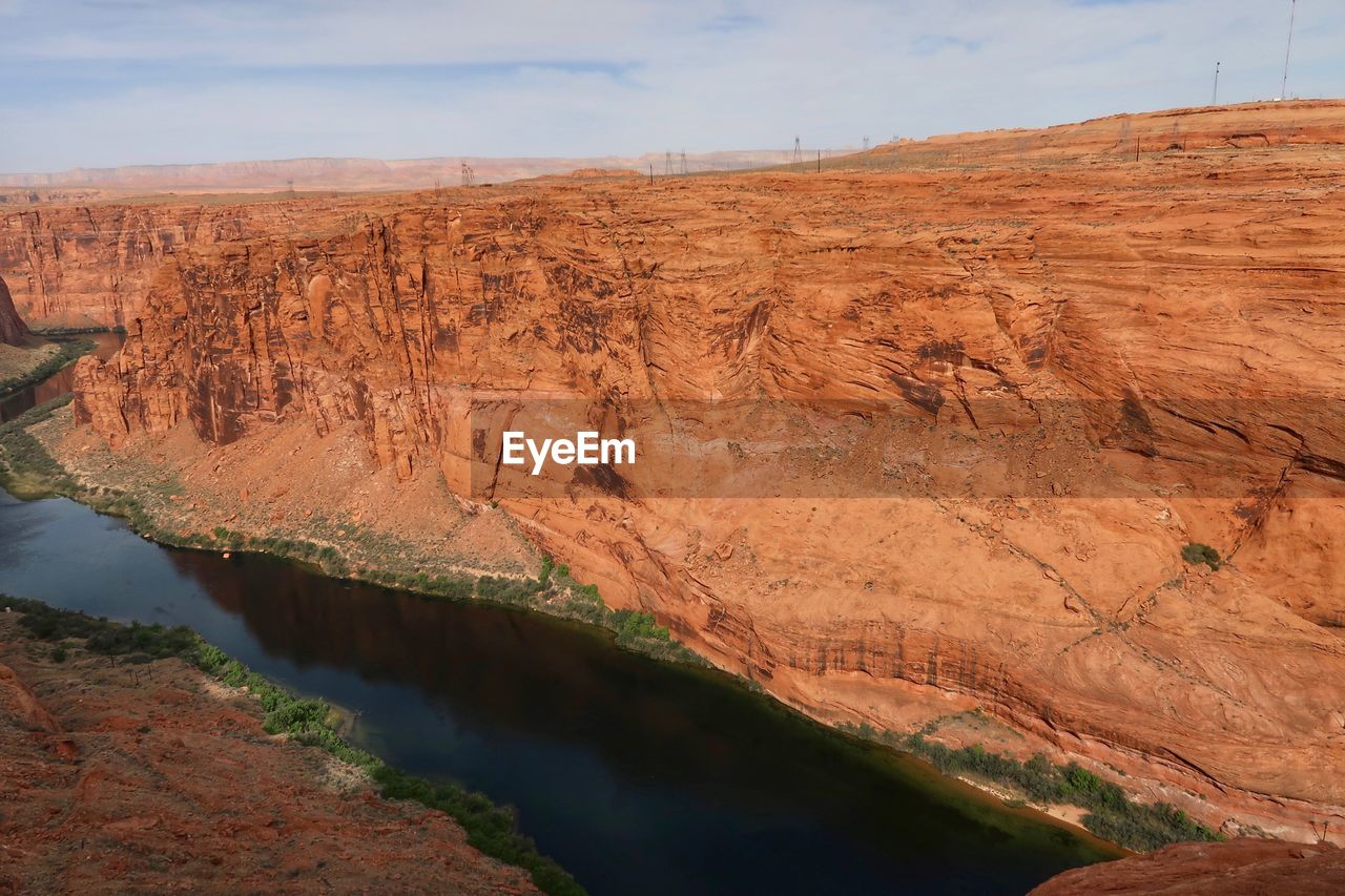 High angle landscape of the colorado river in a deep orange canyon