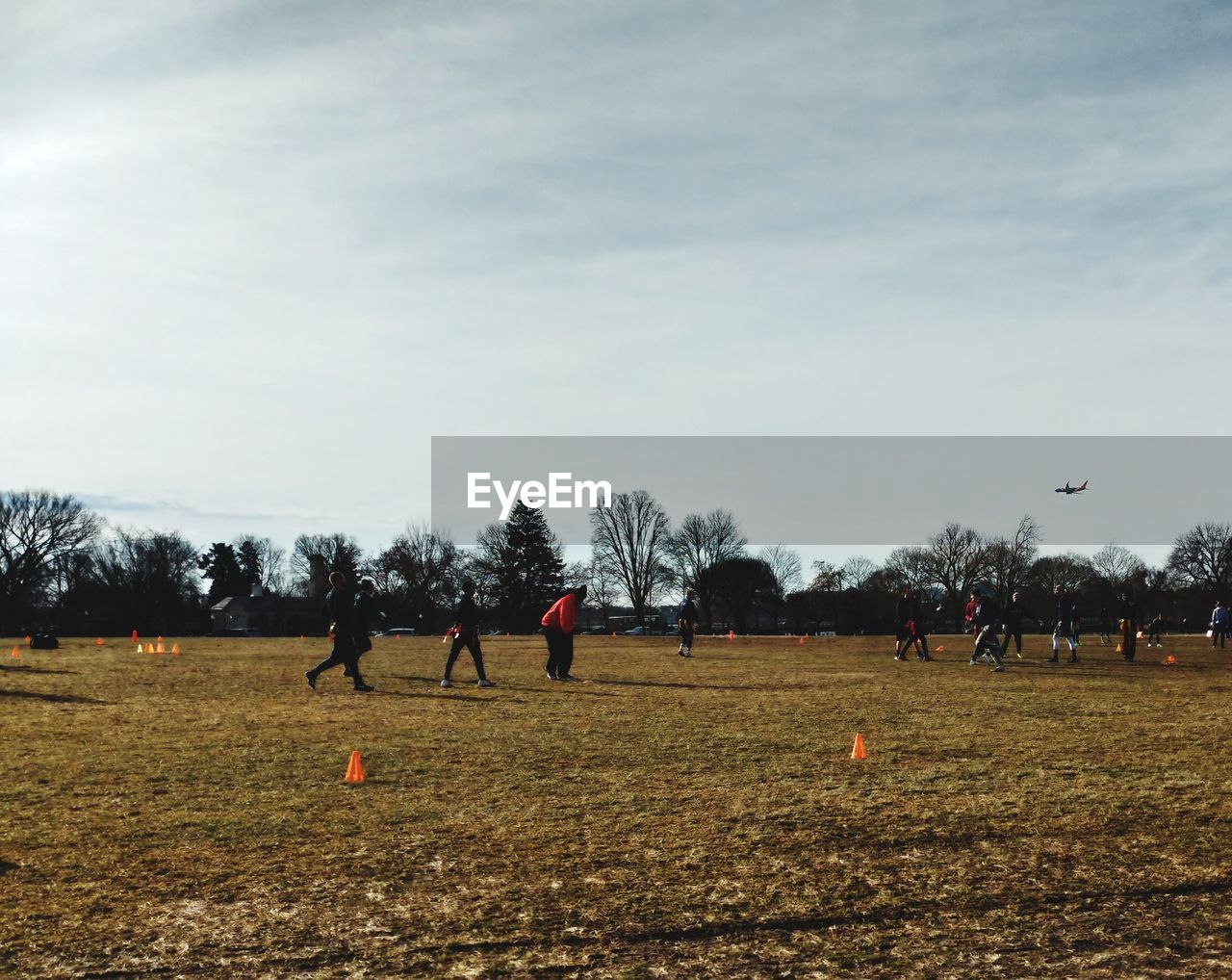 GROUP OF PEOPLE PLAYING SOCCER FIELD
