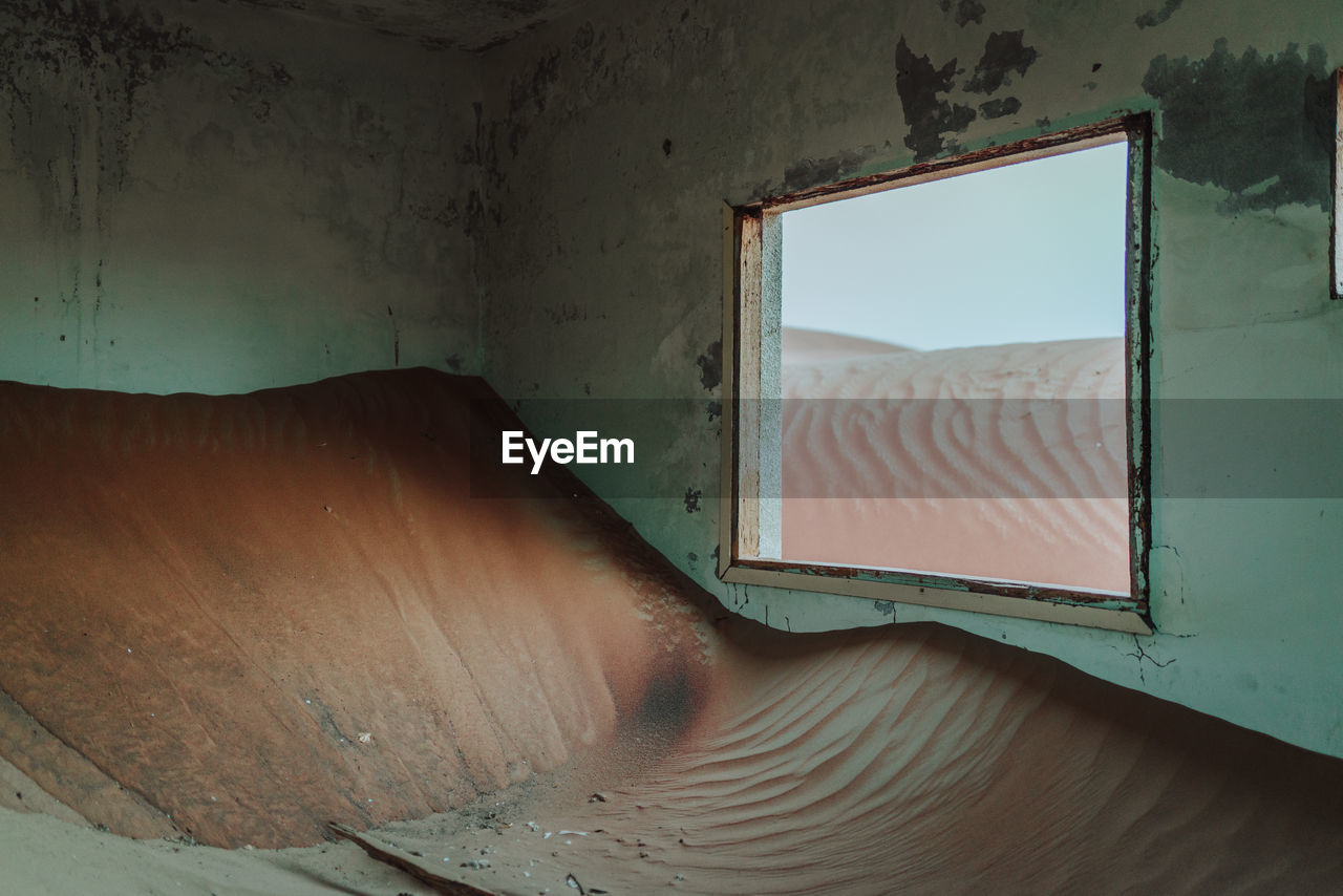 Sand in abandoned house at ghost town