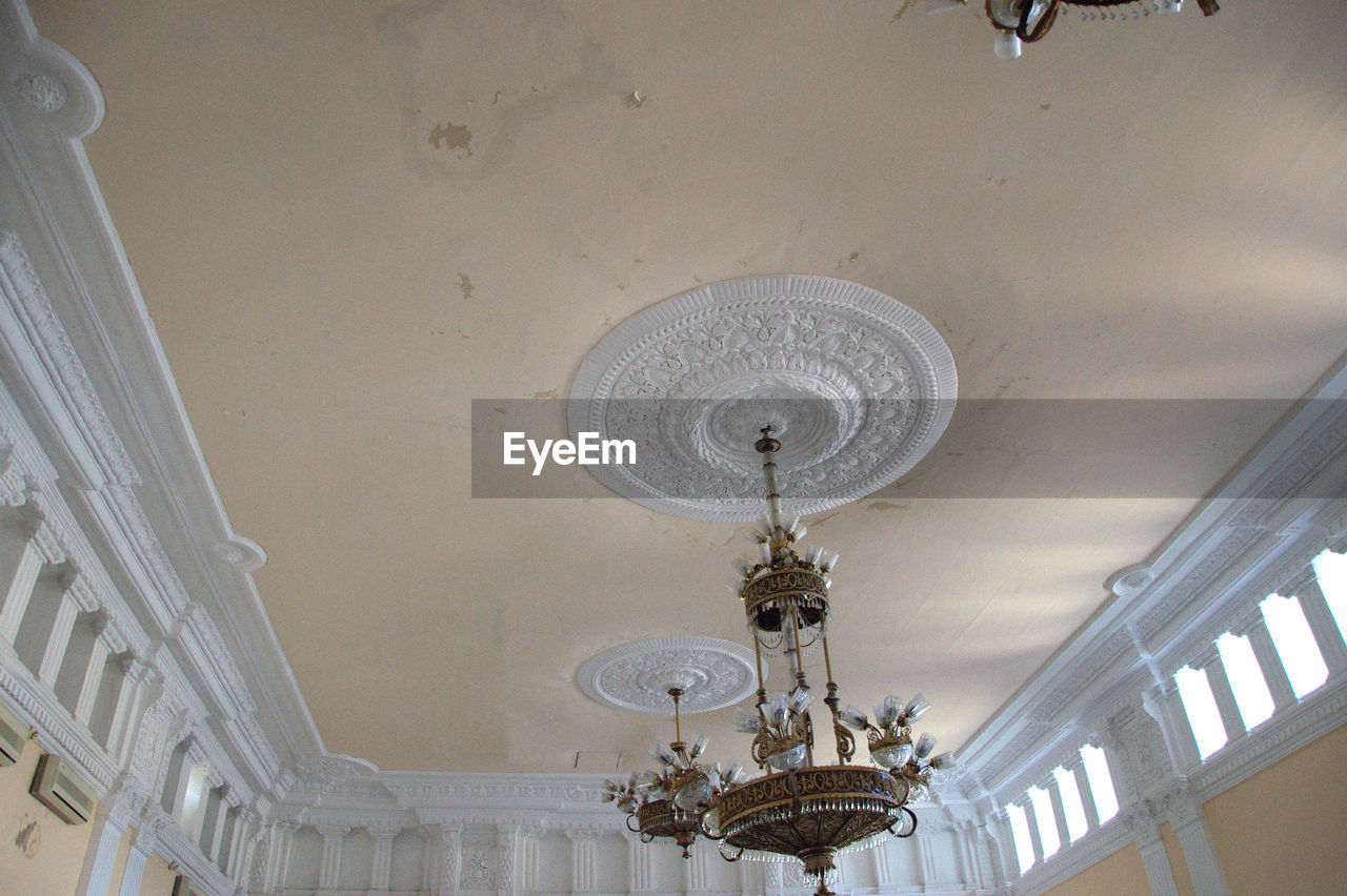 LOW ANGLE VIEW OF TOWER AGAINST SKY SEEN THROUGH CEILING