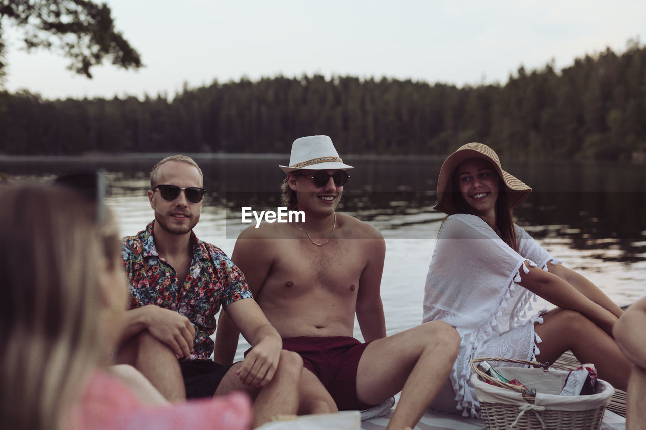 Friends relaxing at lake