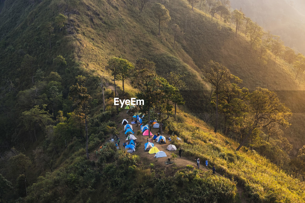 High angle view of people and tents on mountain