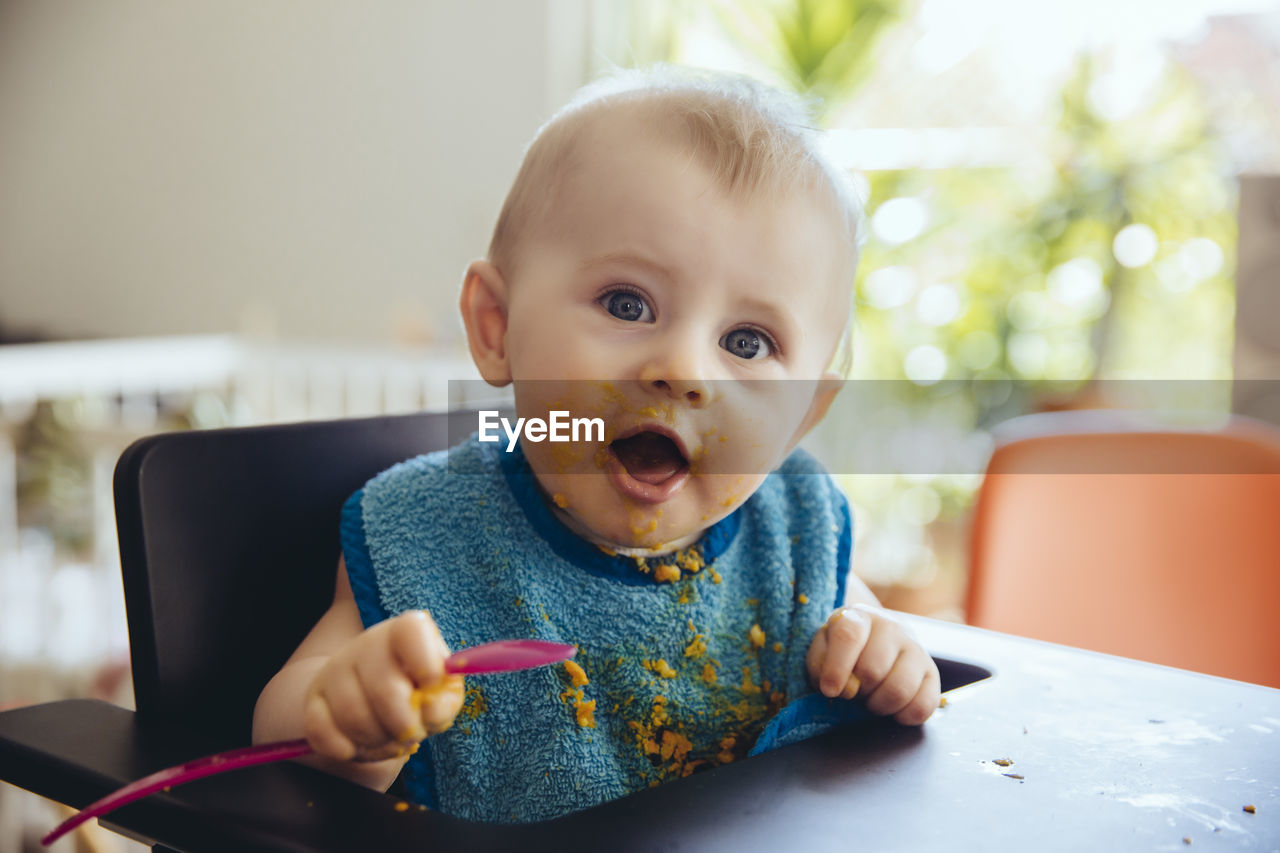 Portrait of baby boy after having a meal