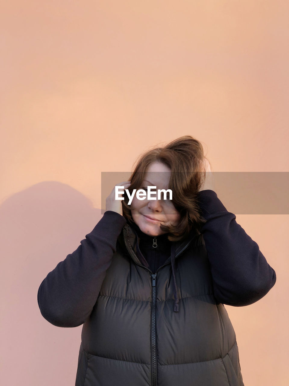 Portrait of woman standing against sky during sunset