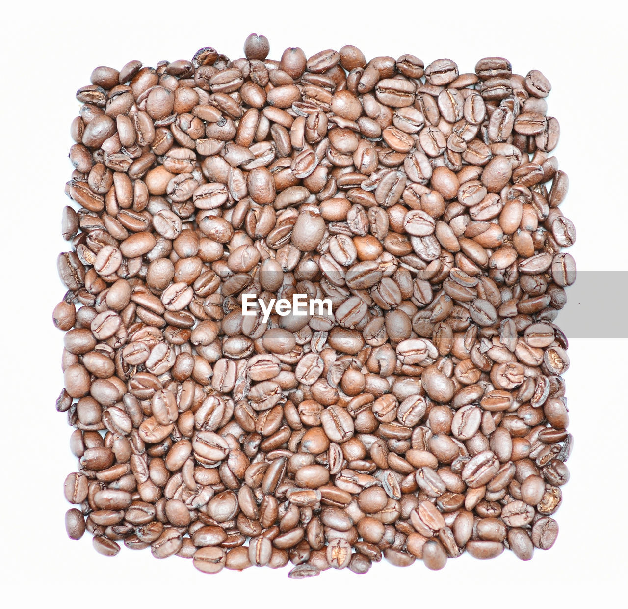 Roasted coffee beans background or wallpaper. a stimulant contains caffeine and is a tasty drink