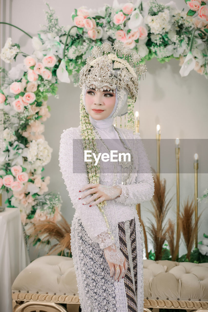 Woman wearing hat at home