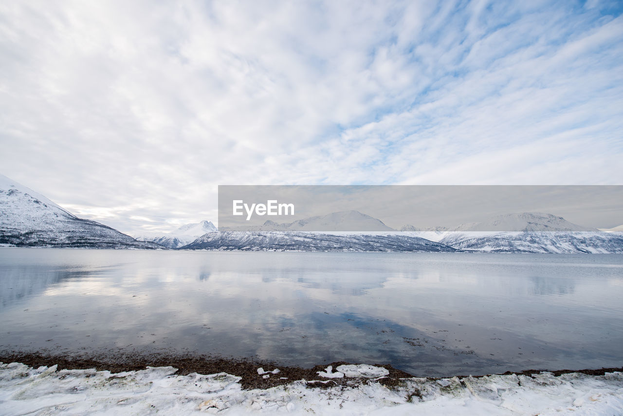 Scenic view of frozen lake against sky