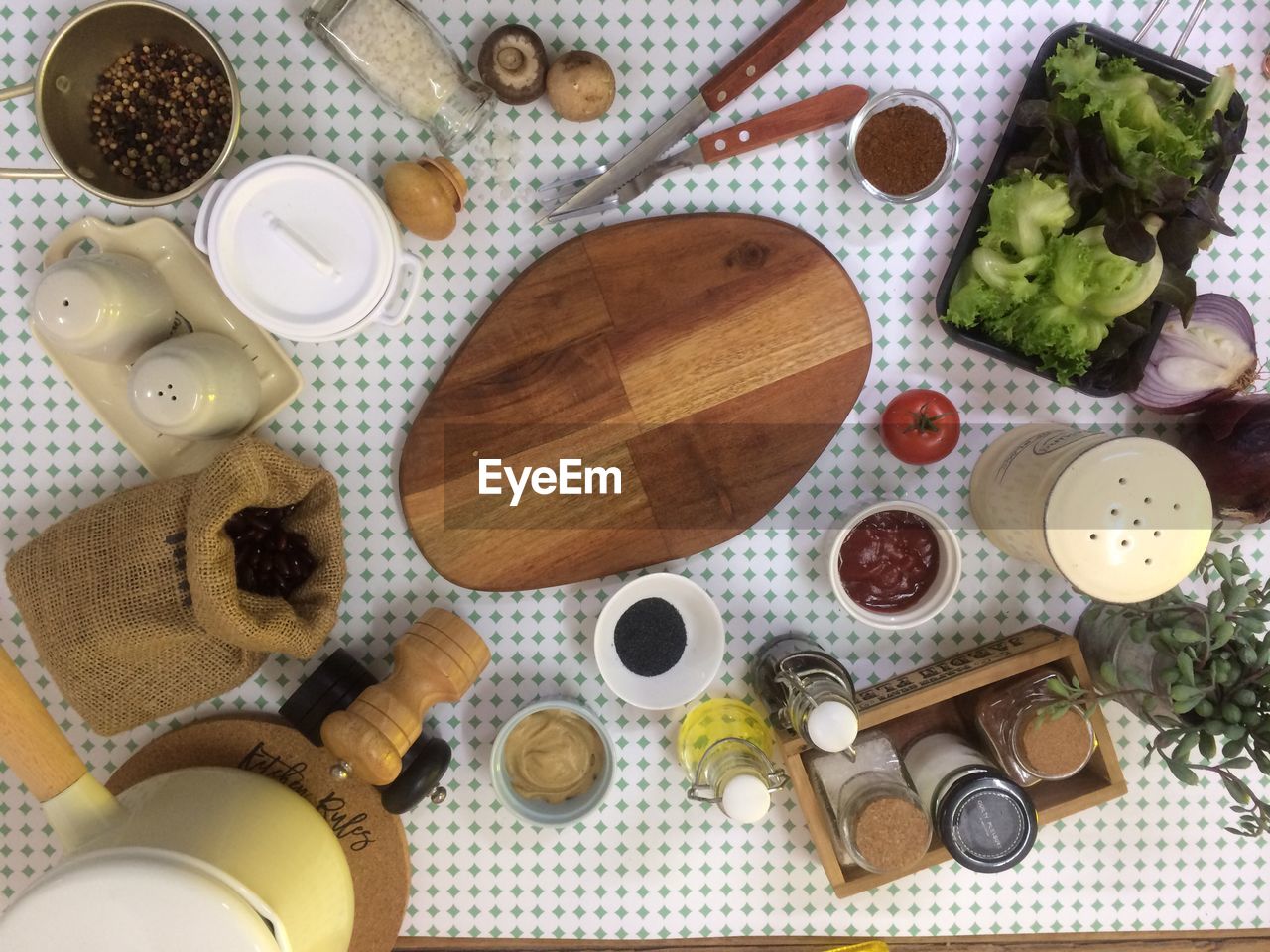 Directly above shot of cutting board and various food on table