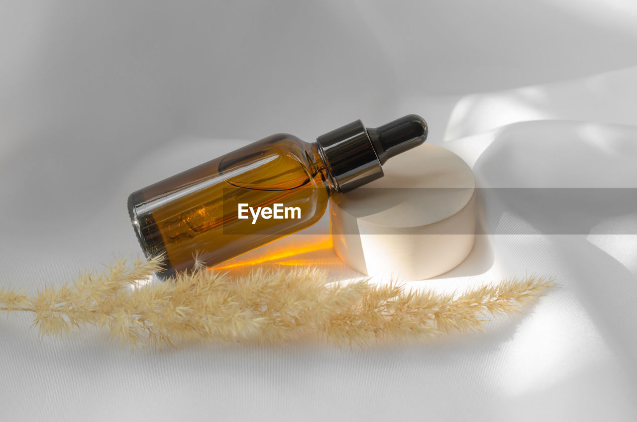 Essential oil or serum in a brown bottle with a dropper. beauty cosmetics, body care.