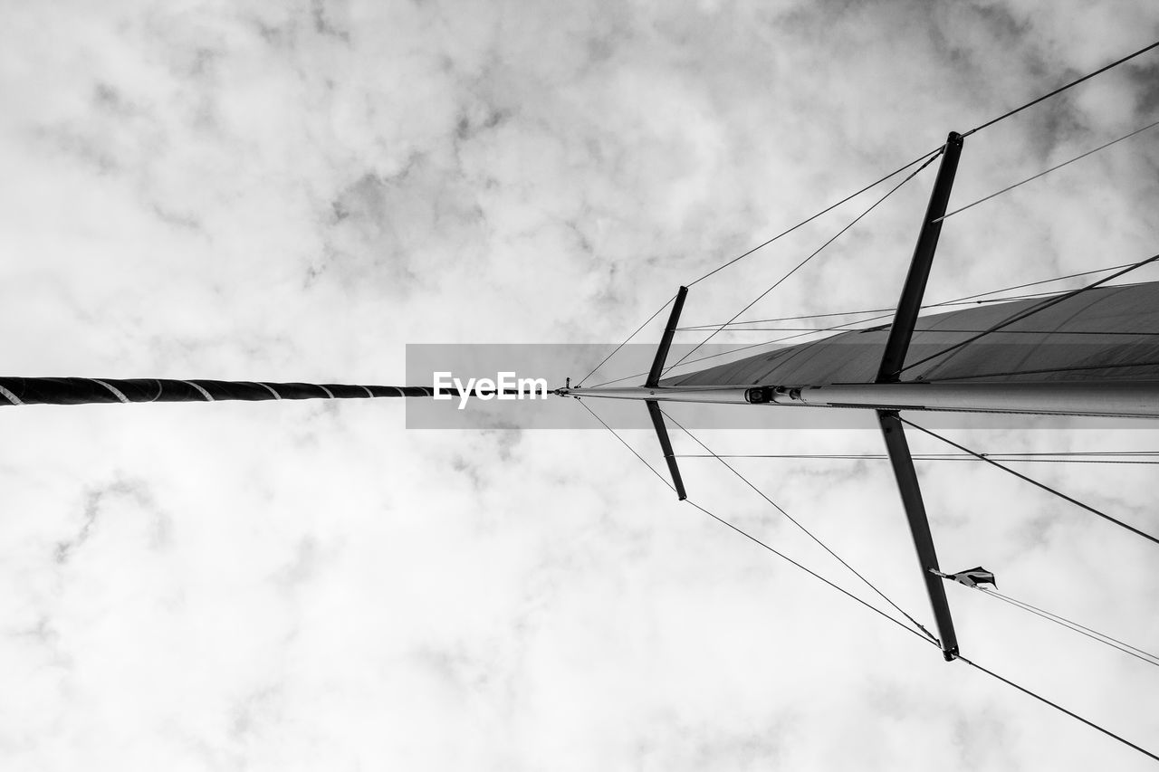 Directly below shot of sailboat mast against sky