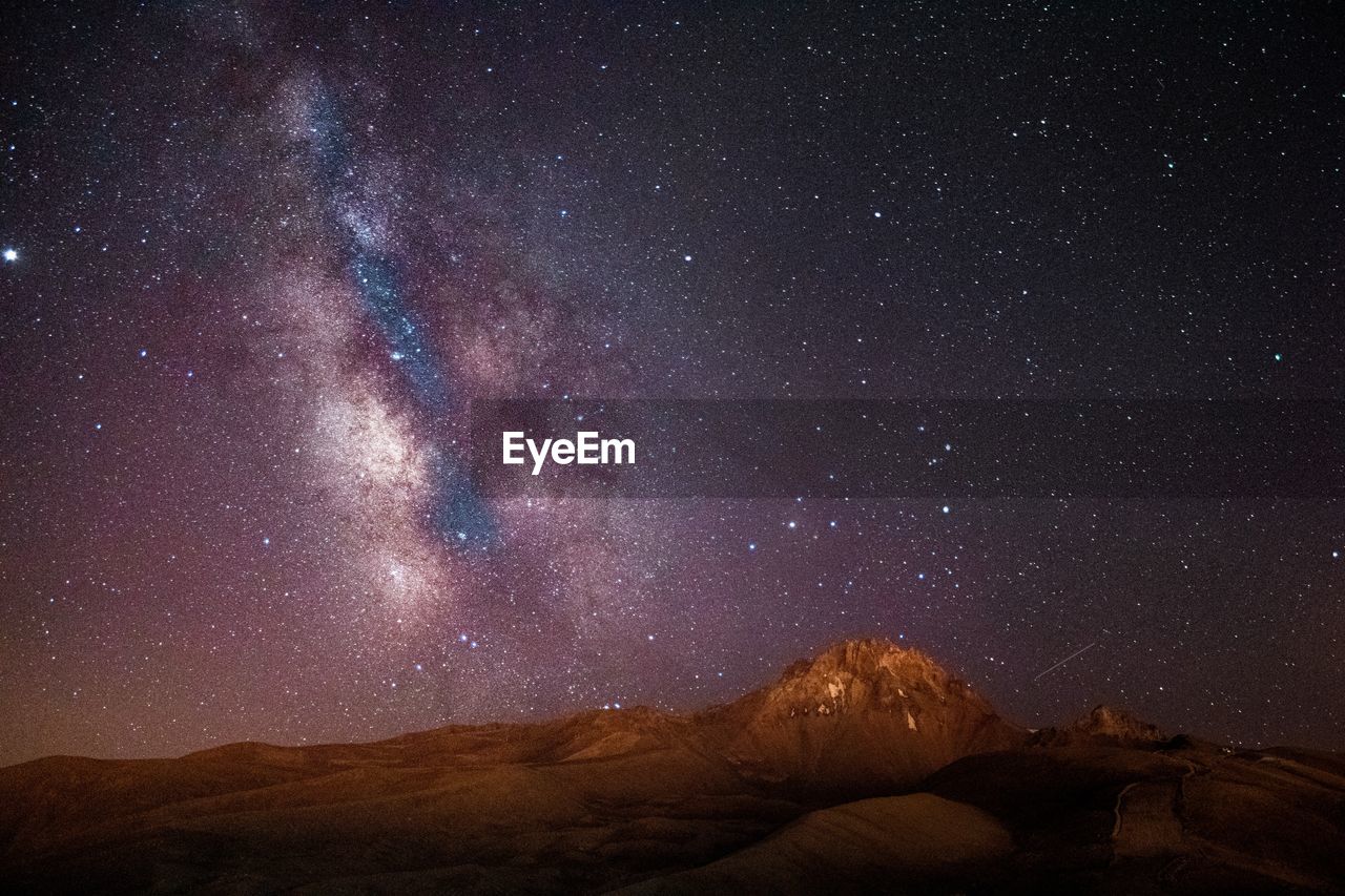 Scenic view of star field against sky at night