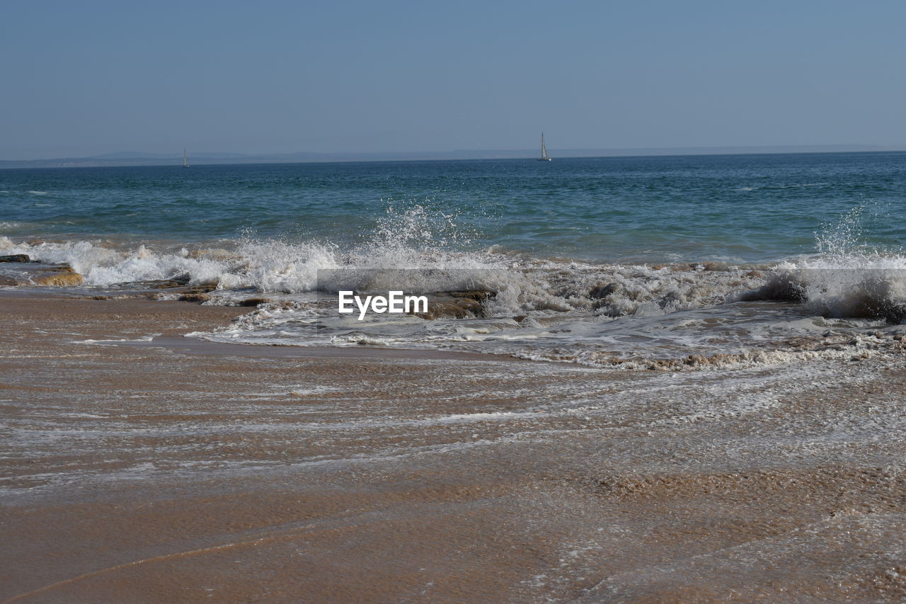 Scenic view of sea against clear sky