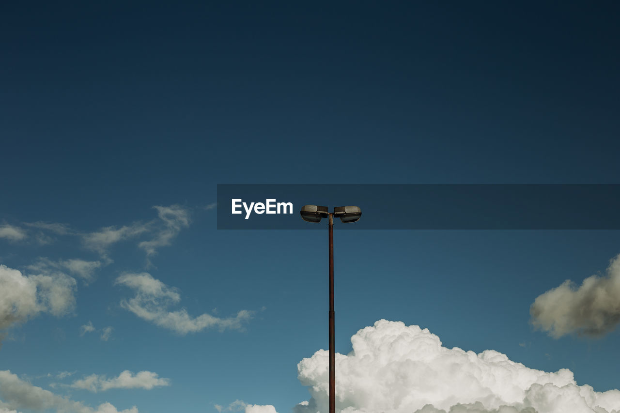 Low angle view of street light against sky