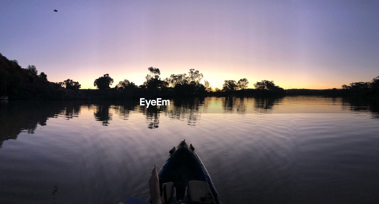 PANORAMIC VIEW OF LAKE AGAINST SKY DURING SUNSET