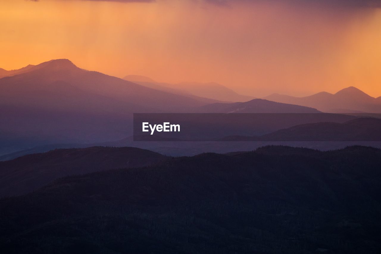 Scenic view of mountains against sky during sunset