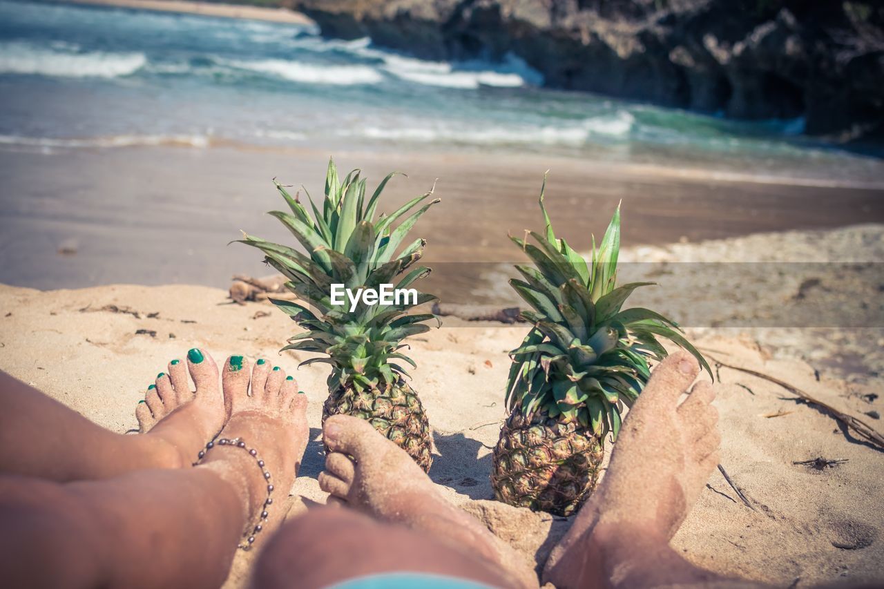 Low section of couple at beach