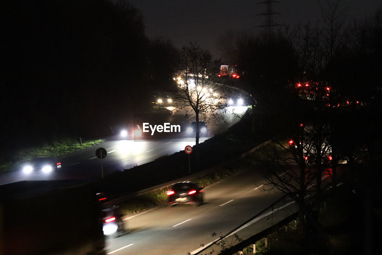 TRAFFIC ON ROAD AT NIGHT