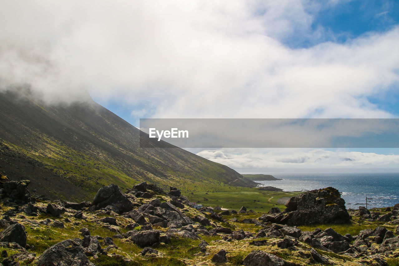 Scenic view of landscape and mountains against sky