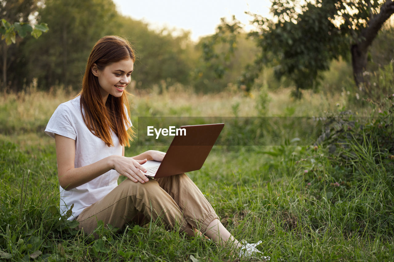 young woman using digital tablet