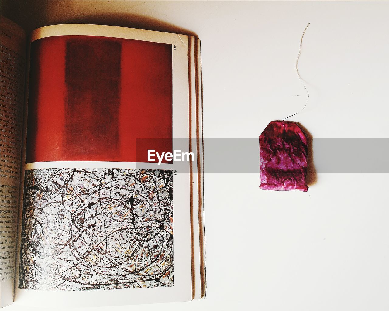 CLOSE-UP OF RED CLOTHES HANGING ON FABRIC