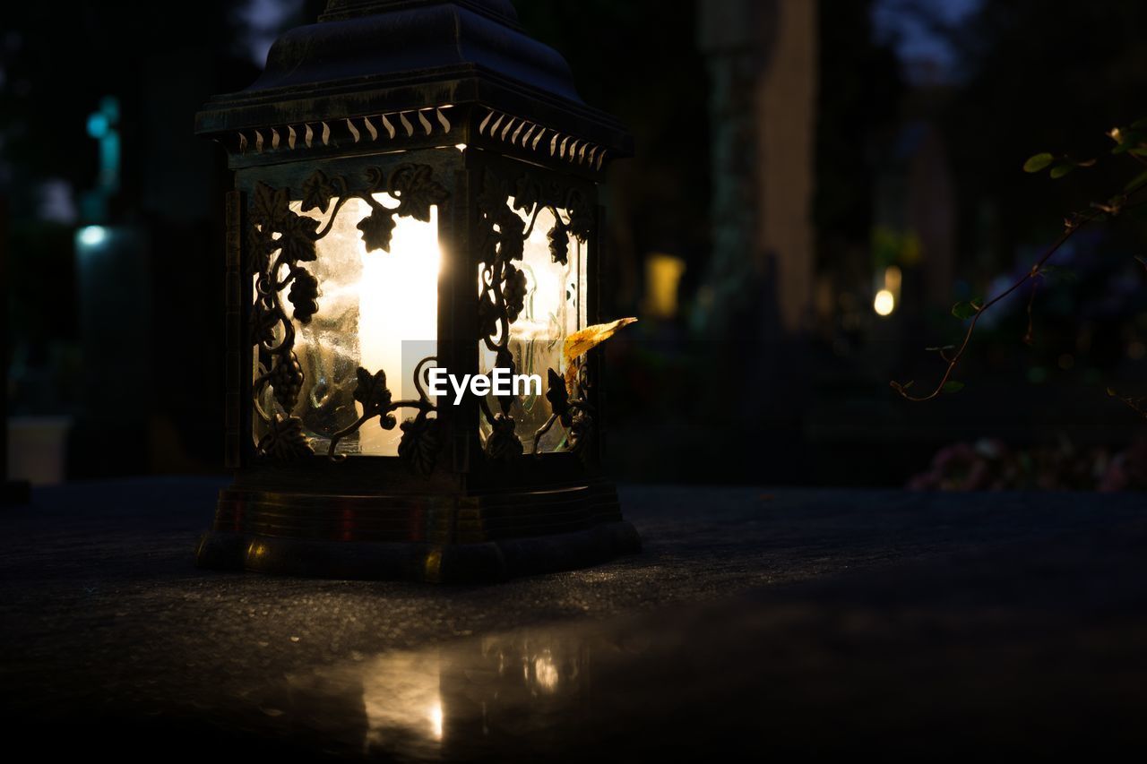 Candle in the night on cemetery during all saints. slovakia