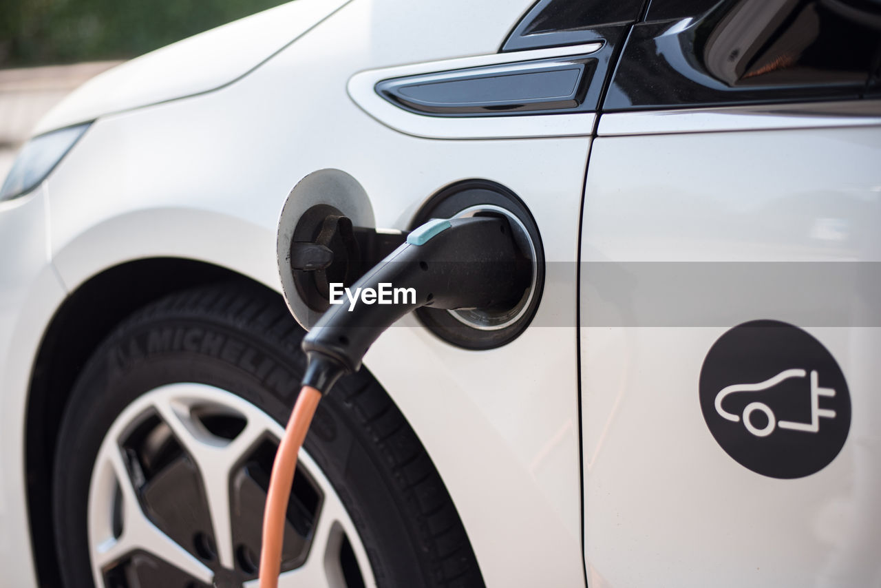 Close-up of electric car being charged