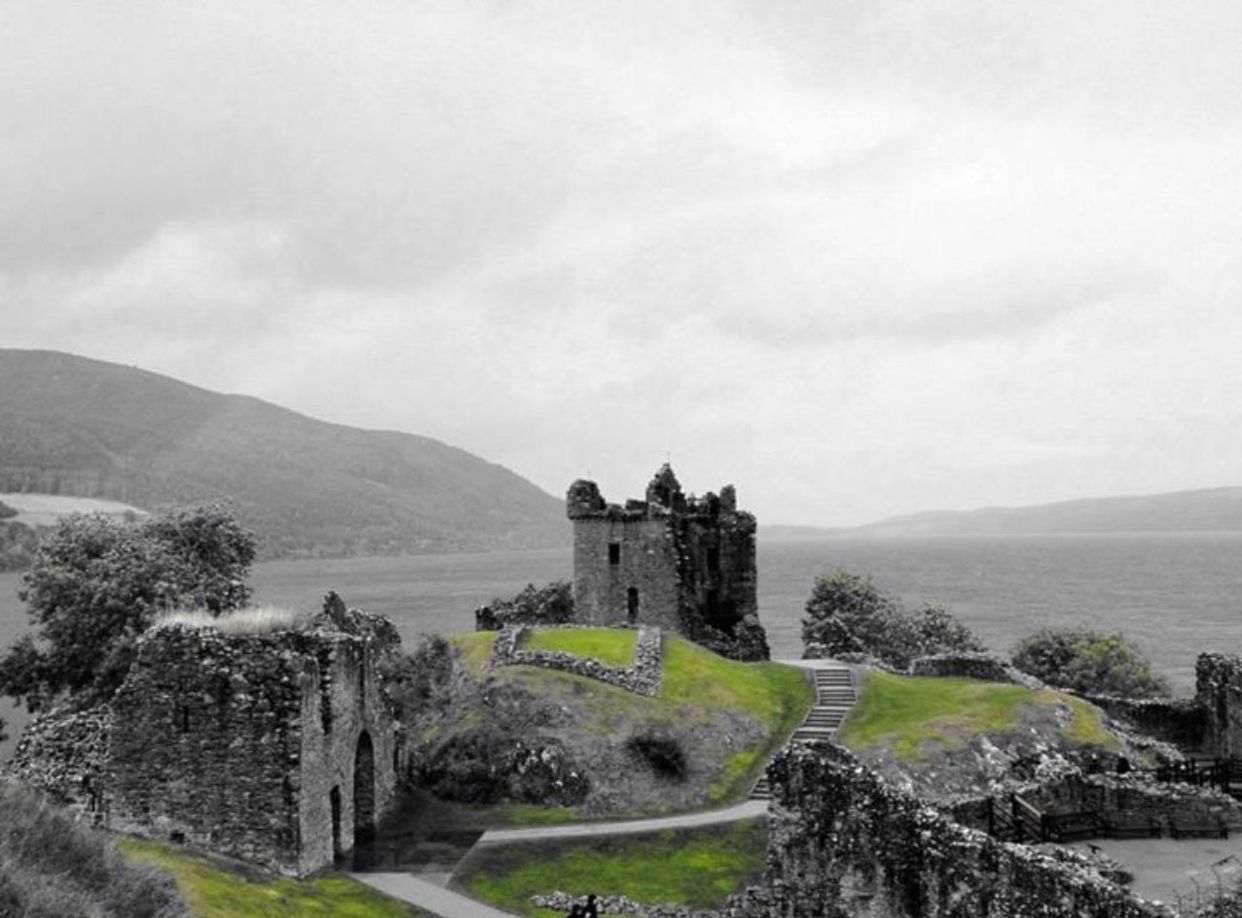 CASTLE ON LANDSCAPE AGAINST CLOUDY SKY